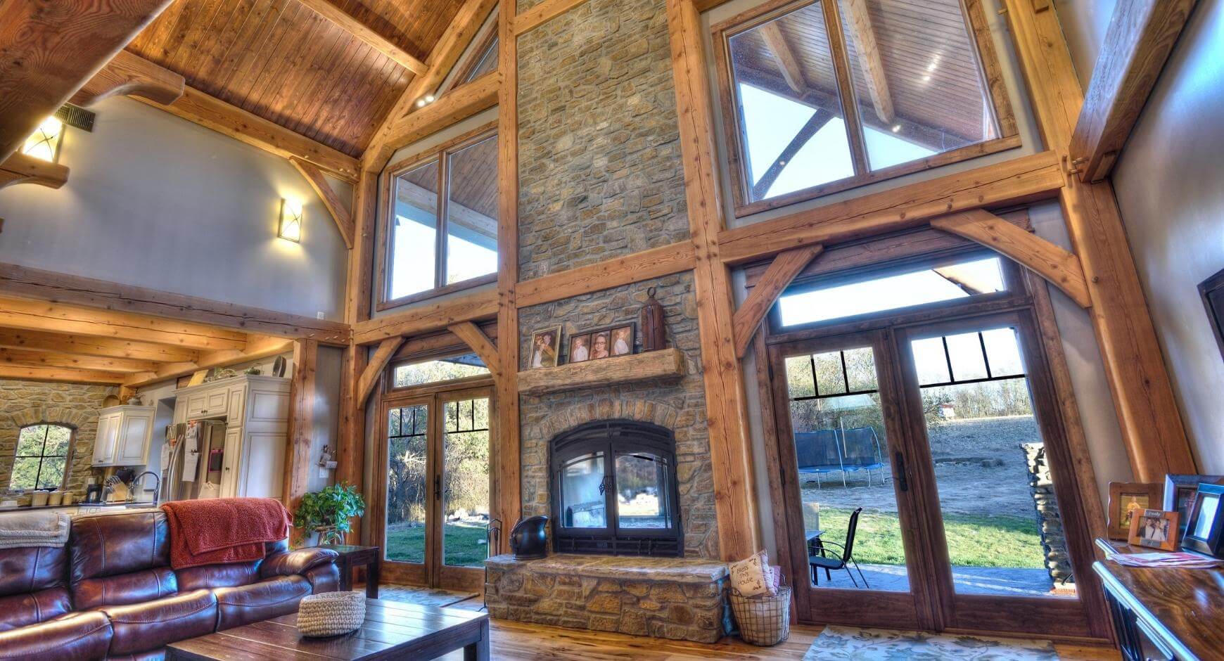 double sided fireplace with stone chimney