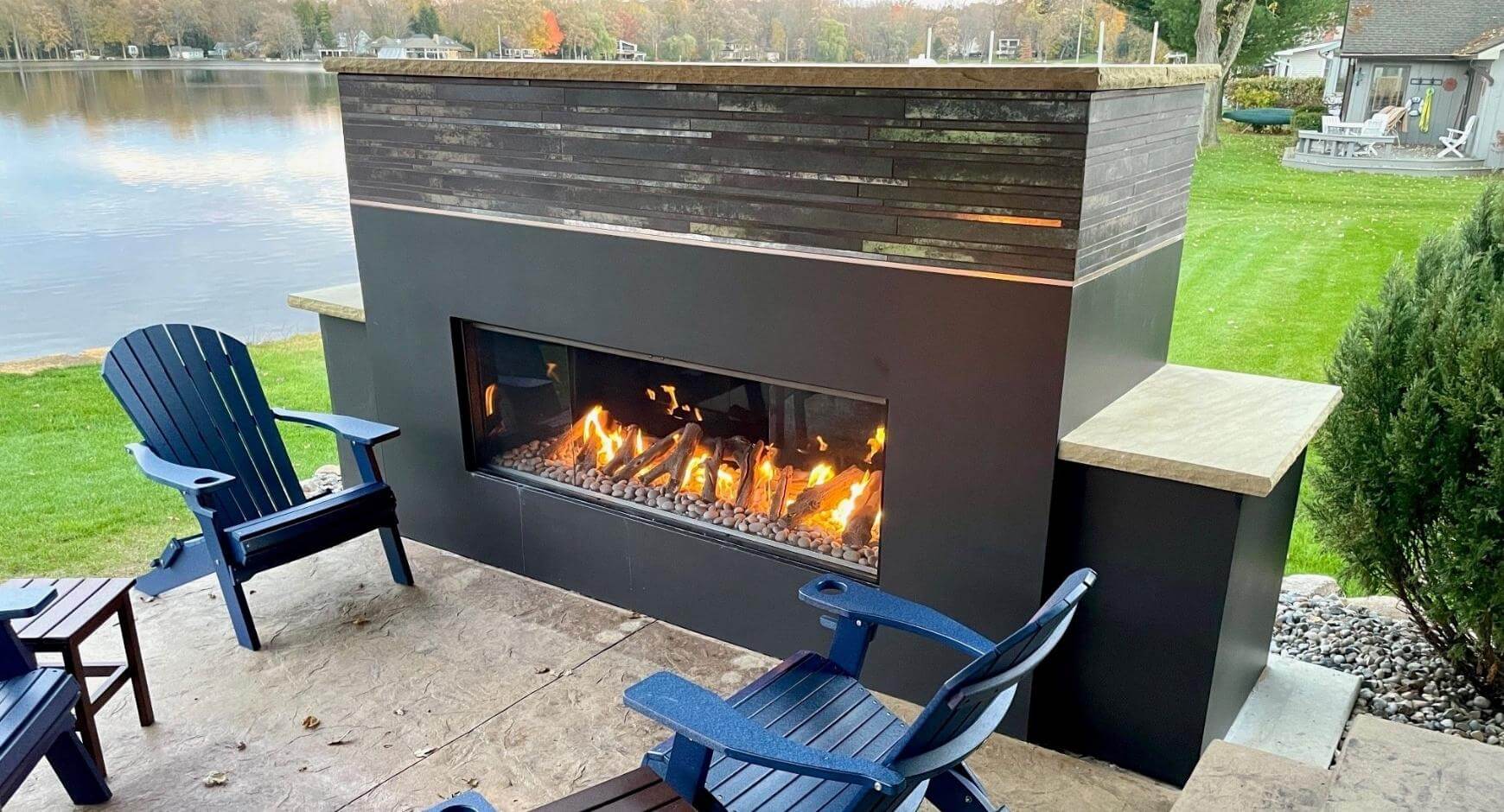Is a fireplace in your home right for you? Image of an outdoor fireplace with chairs around it