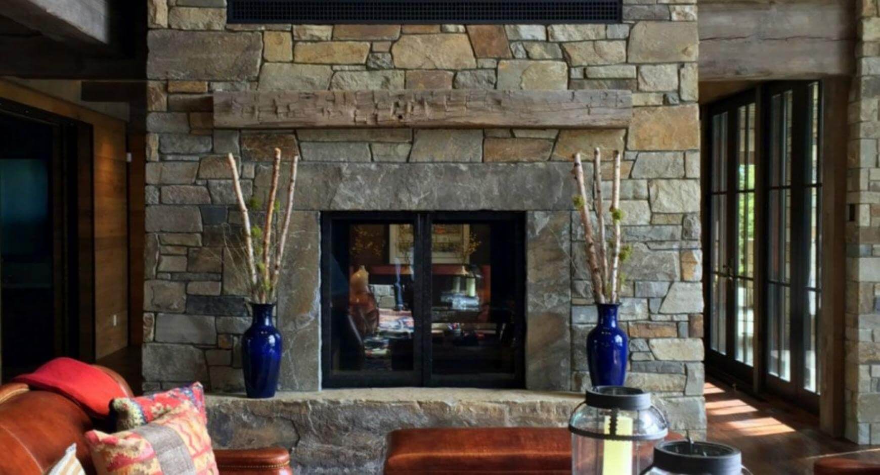 Stone fireplace with glass doors