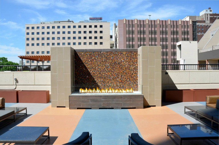 custom outdoor linear gas fire pit on apartment rooftop lounge