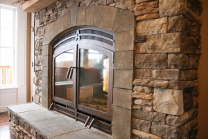 Arched wood see through fireplace