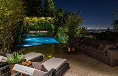 linear outdoor gas fireplace above pool in living wall overlooking downtown los angeles