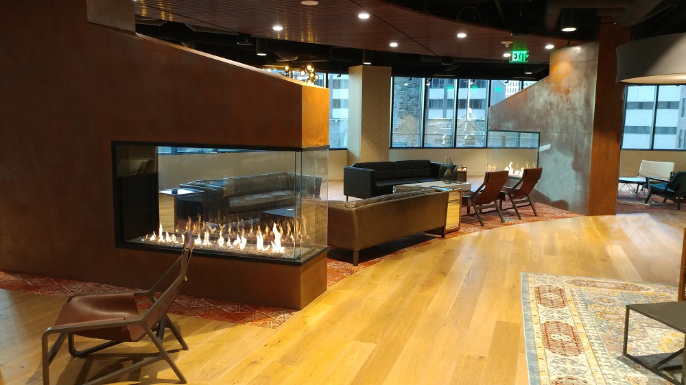 3 sided peninsula gas fireplace in employee lounge at fifth street towers minneapolis