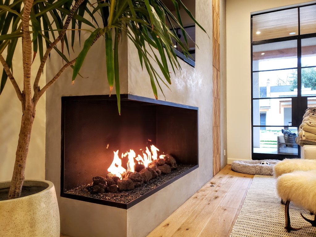 open multi view fireplace with firescreen in modern home