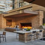 custom outdoor open gas fireplace on apartment rooftop shared space