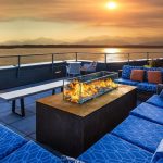 outdoor gas fire table fire pit on rooftop deck overlooking the ocean