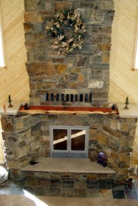 great room single sided wood burning fireplace with masonry finish