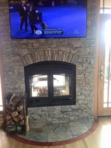 see through wood burning fireplace in residential home