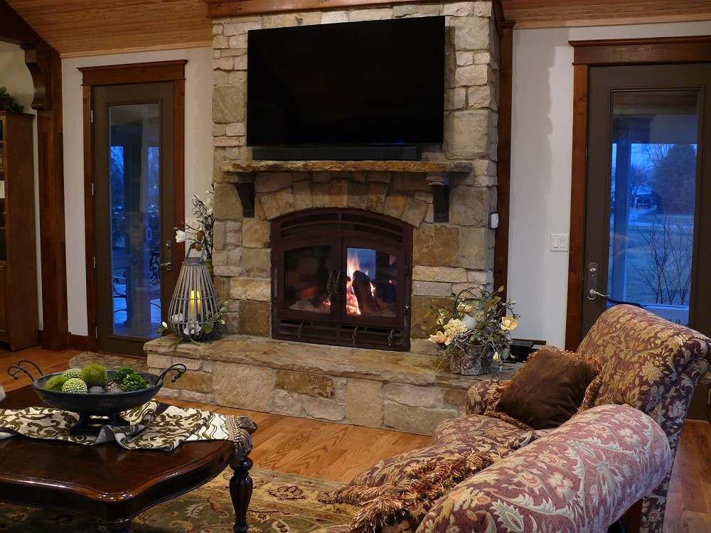 indoor outdoor fireplace in cozy living room