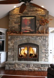 see through wood burning fireplace interior side of living room