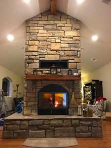 chalet see through wood burning fireplace in living room
