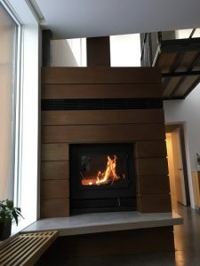 single sided modern wood burning fireplace in private residence