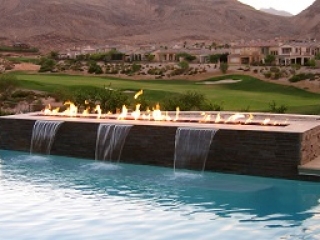 outdoor gas fire table with water feature in pool
