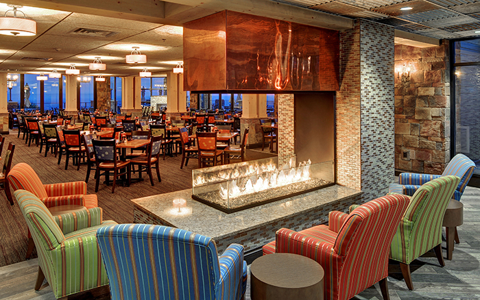 acucraft peninsula 3sided gas fireplace with open viewing area in ski resort restaurant