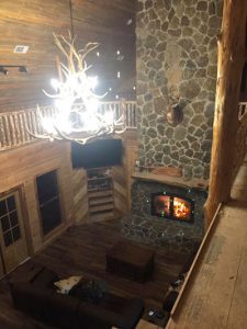 acucraft indoor outdoor see through wood burning fireplace interior side cabin