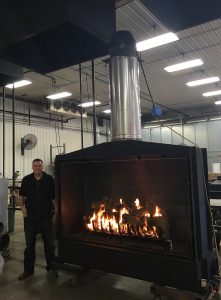 open gas fireplace with log set being tested in test labl