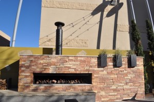 Logs and Stones in Gas Burning Fireplace