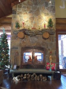 indoor outdoor see through wood burning fireplace in new construction home