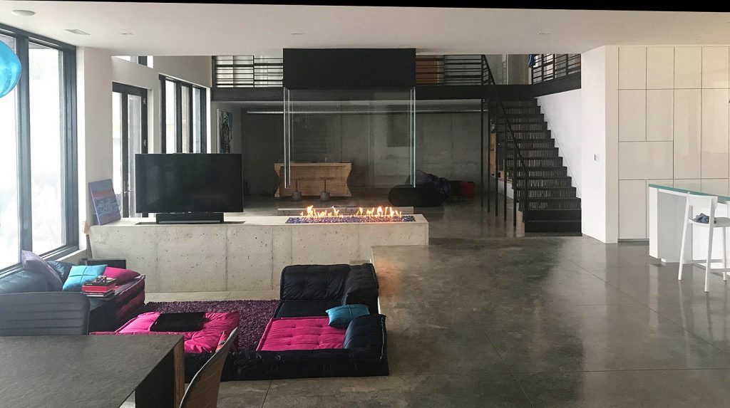 four sided indoor gas fire pit with open reveal in modern sunken living room