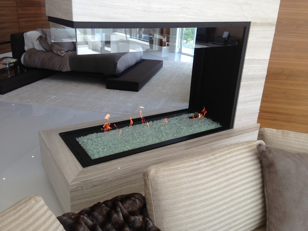 3 sided peninsula gas fireplace with open viewing area in modern bedroom