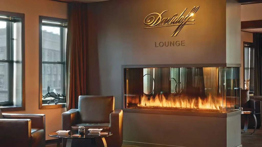 cigar lounge with 3 sided peninsula gas fireplace