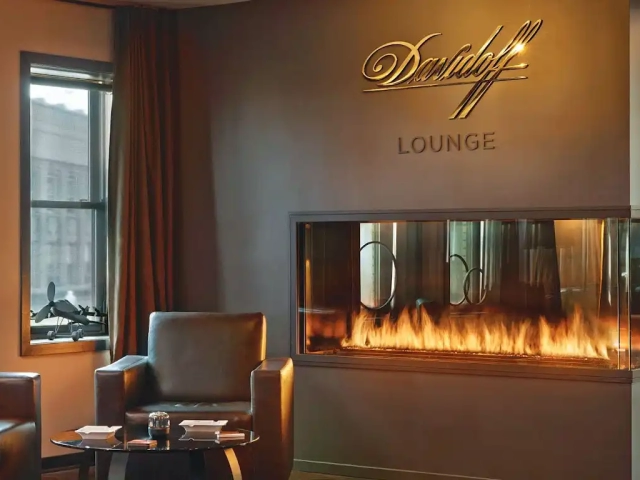 cigar lounge with 3 sided peninsula gas fireplace