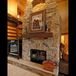 see through wood burning fireplace with masonry finish