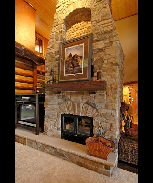 see through wood burning fireplace with masonry finish