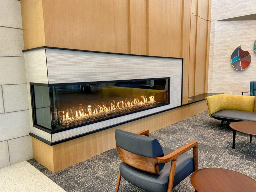Acucraft Custom Linear Front & Side Gas Fireplace with Glass Meda & River Rock (2)