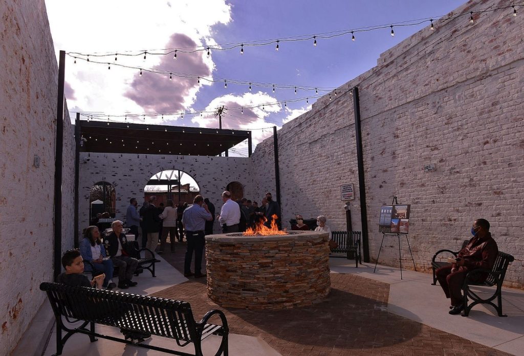 Circular stone fire pit in outdoor courtyard