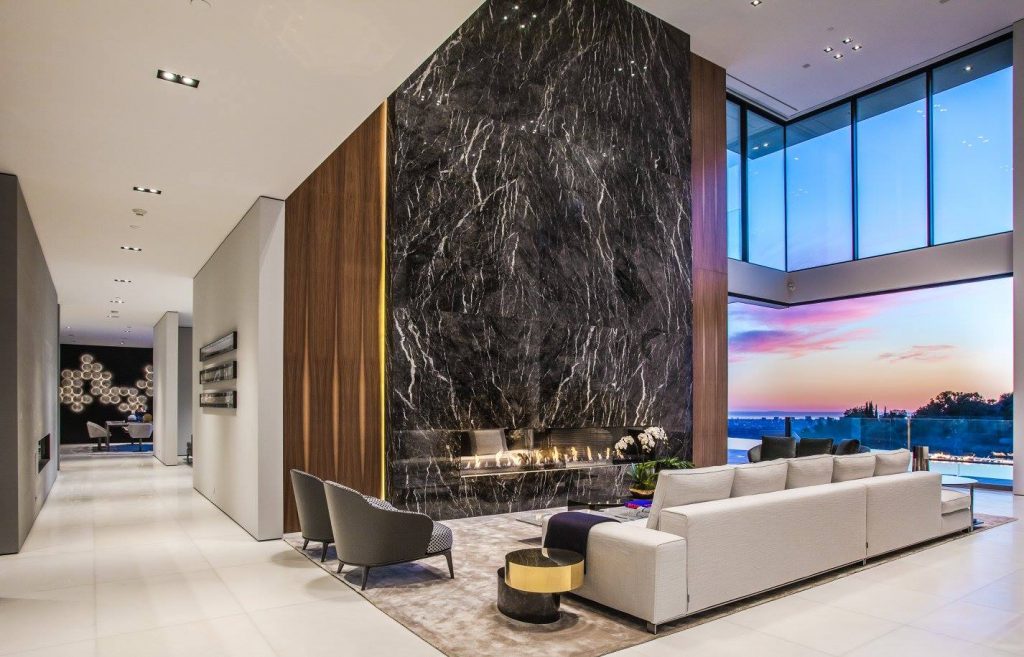 a large linear fireplace in a living area