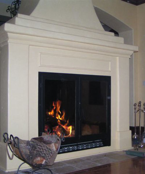 large see through wood fireplace with white surround