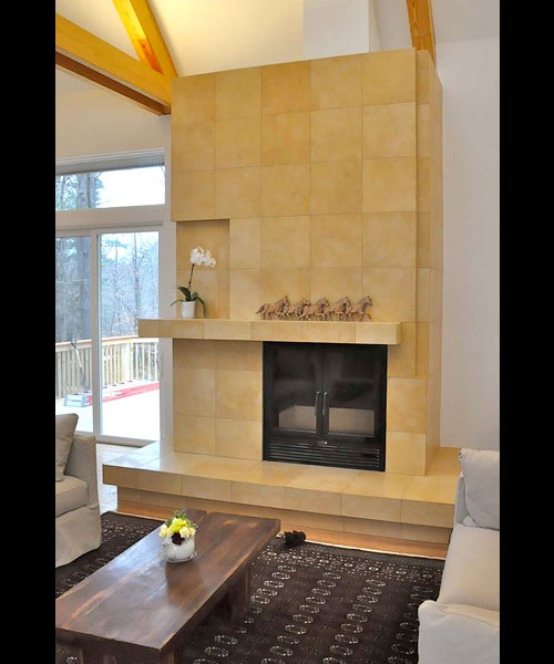 single sided wood burning fireplace with tile finish in living room