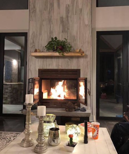 see through wood burning fireplace in living room