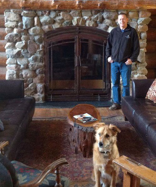 large wood burning fireplace with stone surround