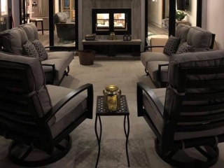 indoor outdoor see through wood burning fireplace in exterior porch