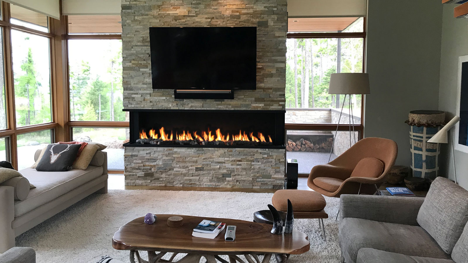 3-sided Acucraft panoramic open gas fireplace with TV above