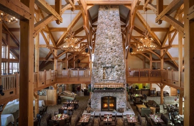 Custom four sided wood burning fireplace at Vermont ski resort