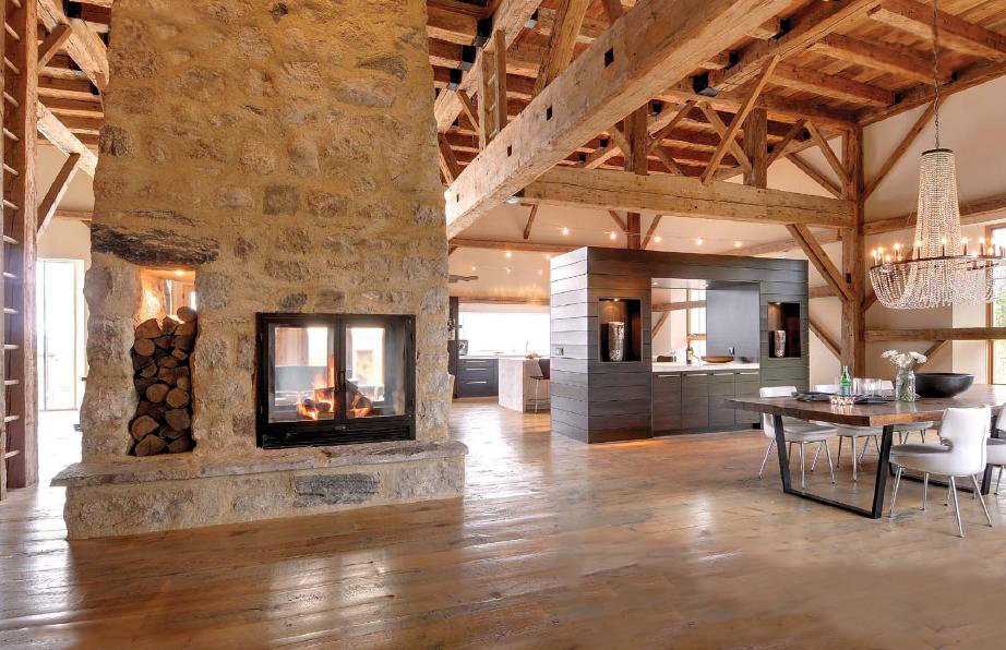 see through double sided wood fireplace in modern open floor plan