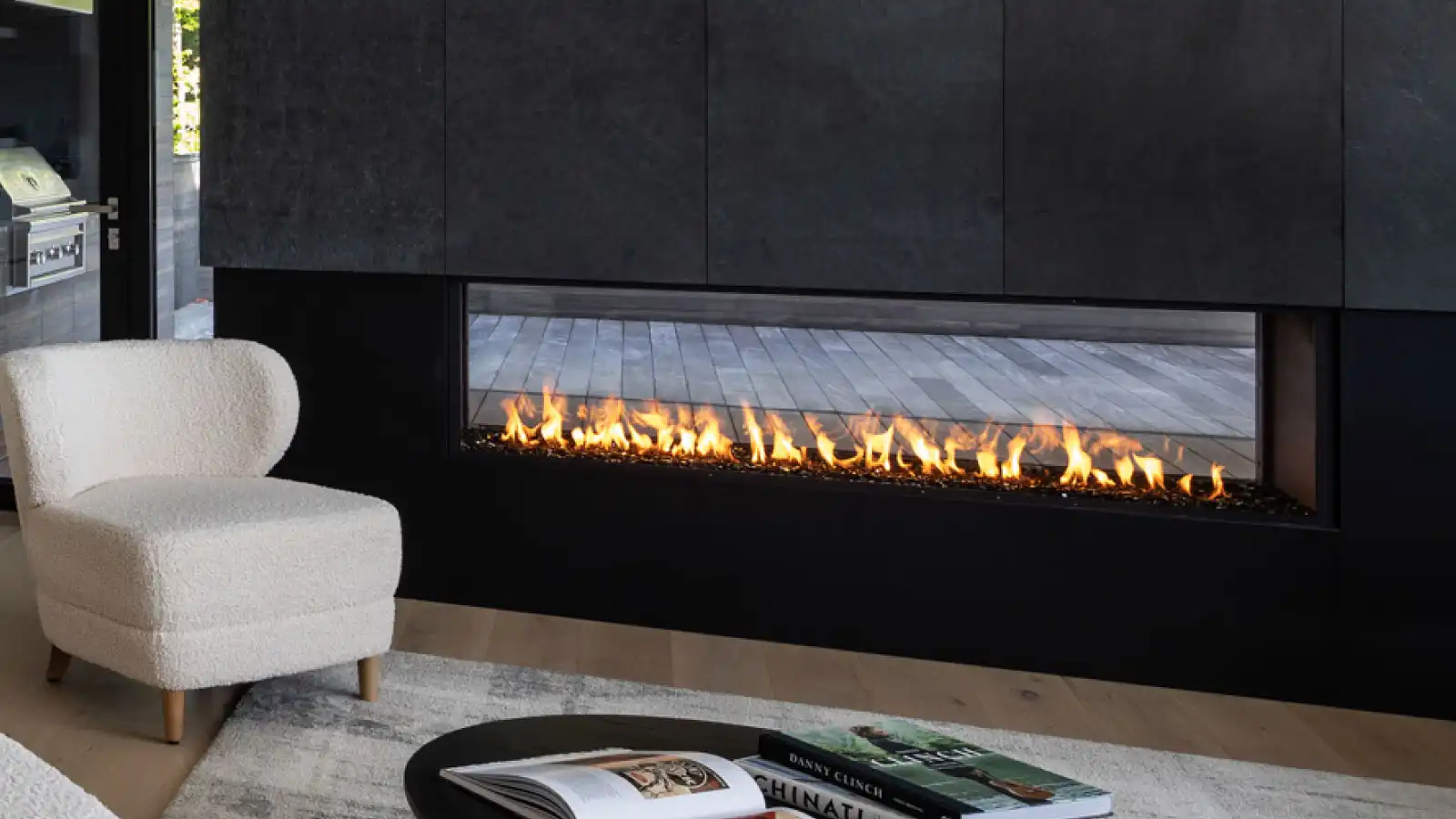 modern living room with double sided linear indoor outdoor gas fireplace