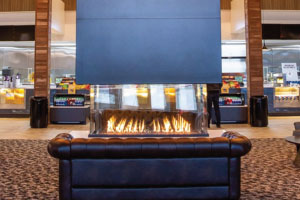 four sided indoor gas fireplace emagine theater