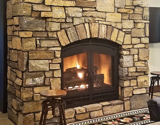 wood burning fireplace with gas log set