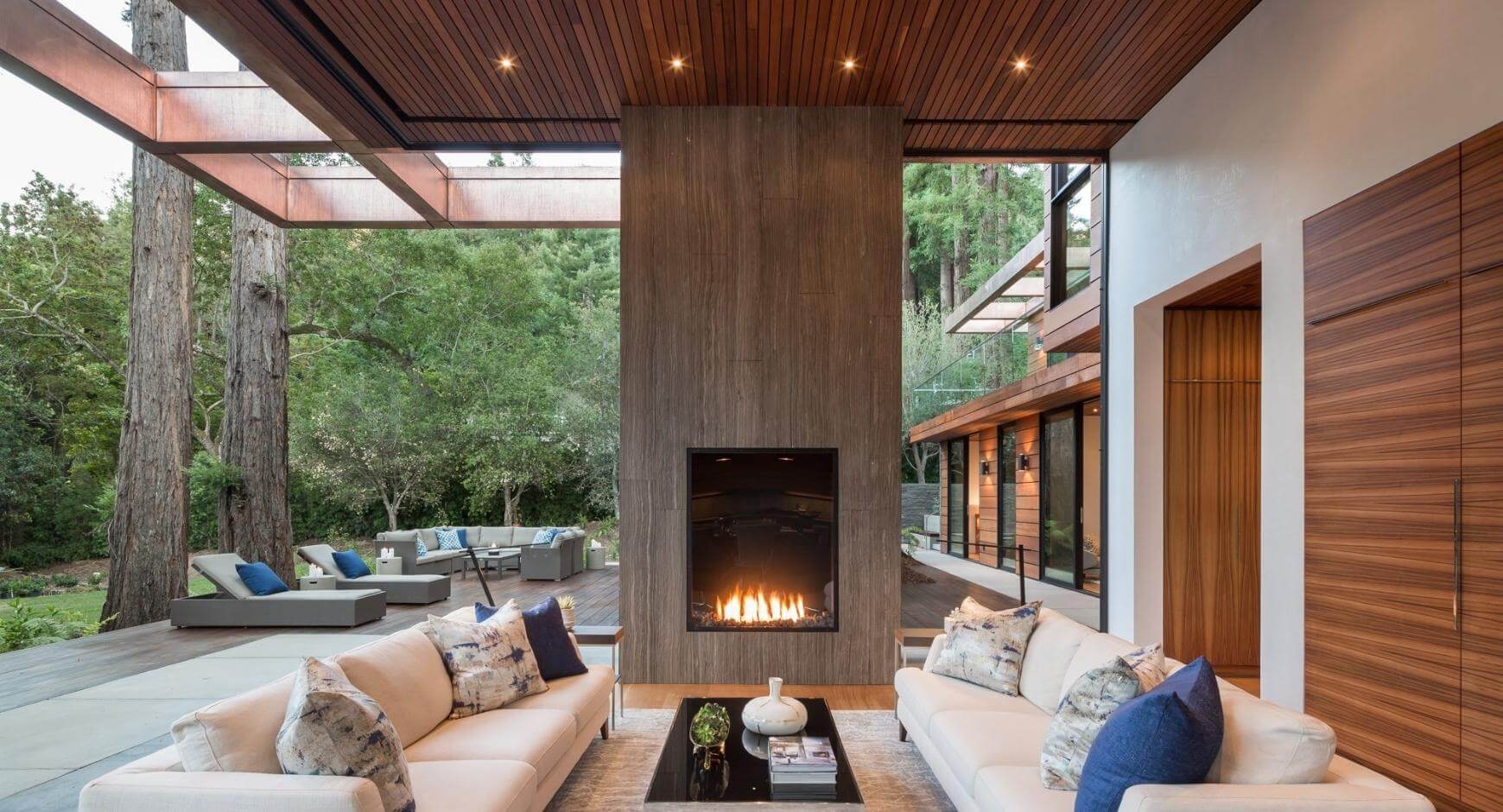 tall concrete fireplace in open patio