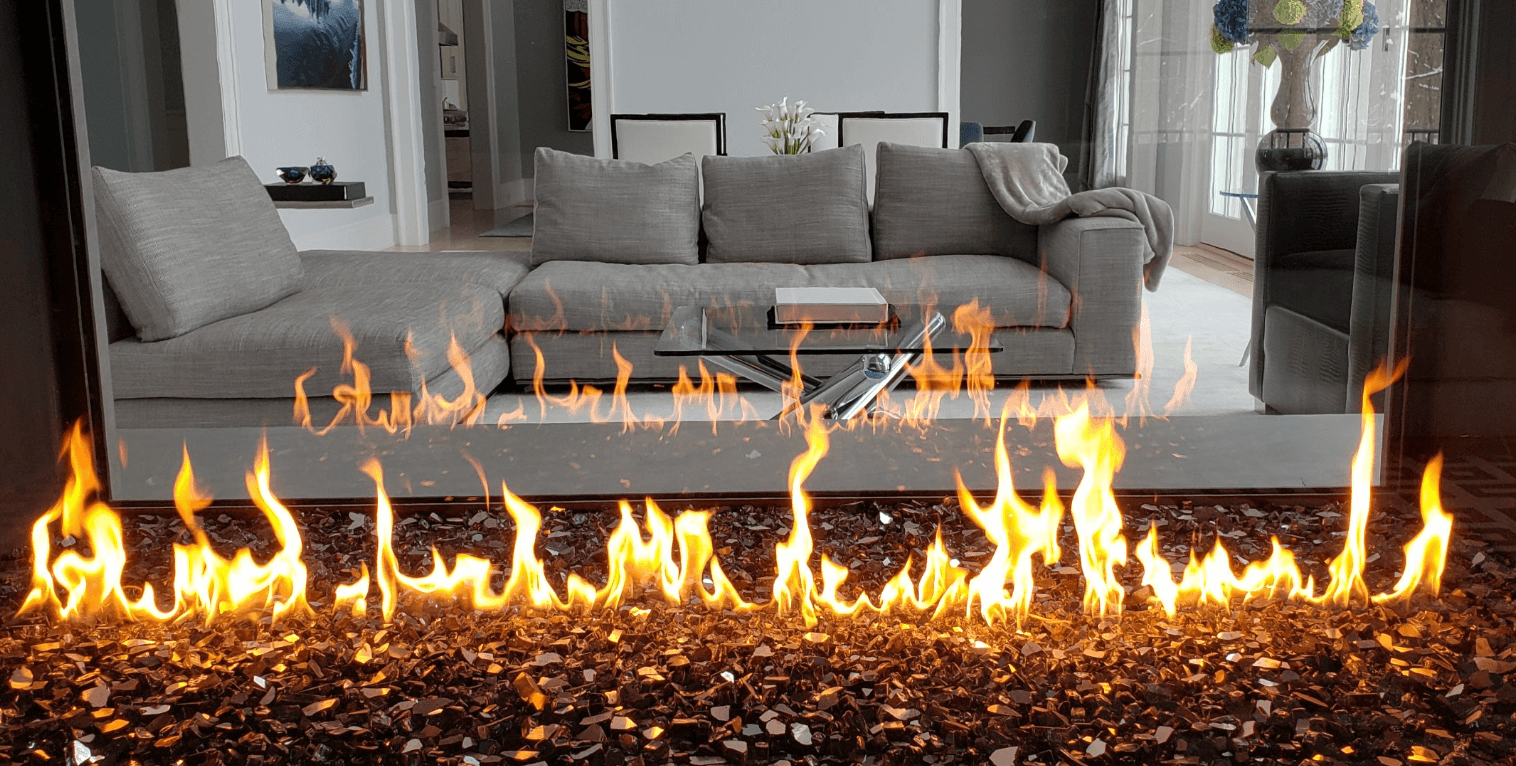 Comfortable house interior viewed through a see-through fireplace