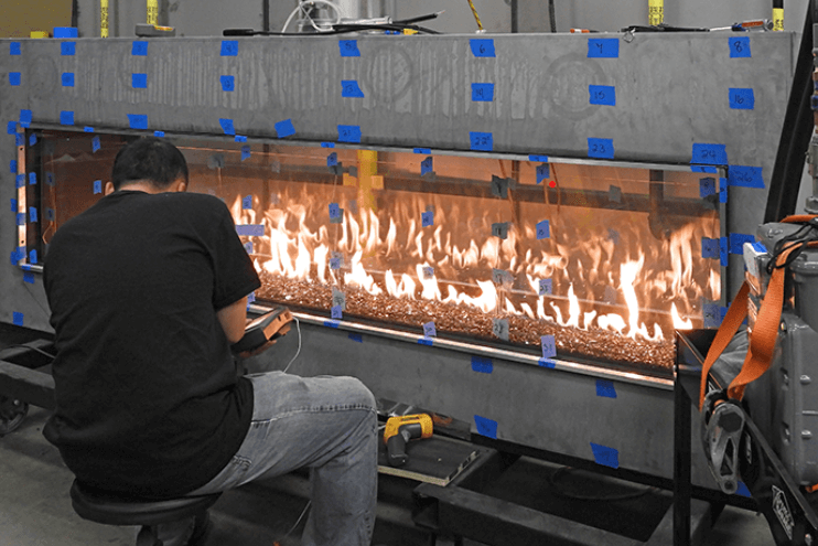 Image of a man carrying out the fireplace safety certification process