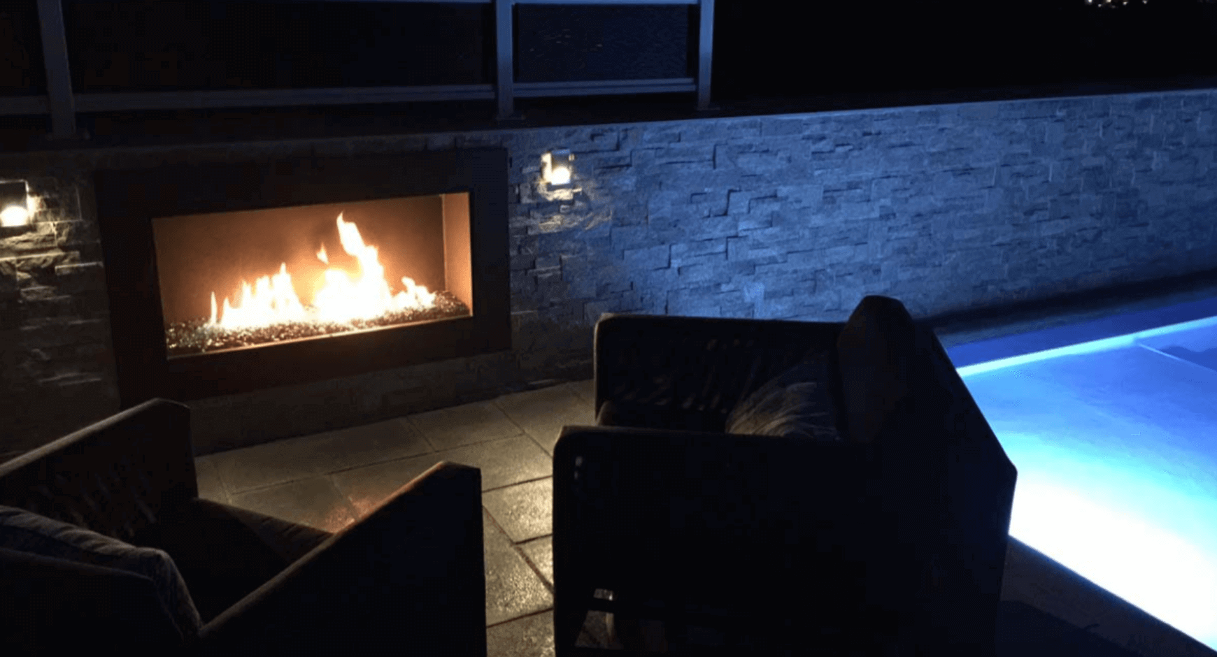 Outdoor brick fireplace at night