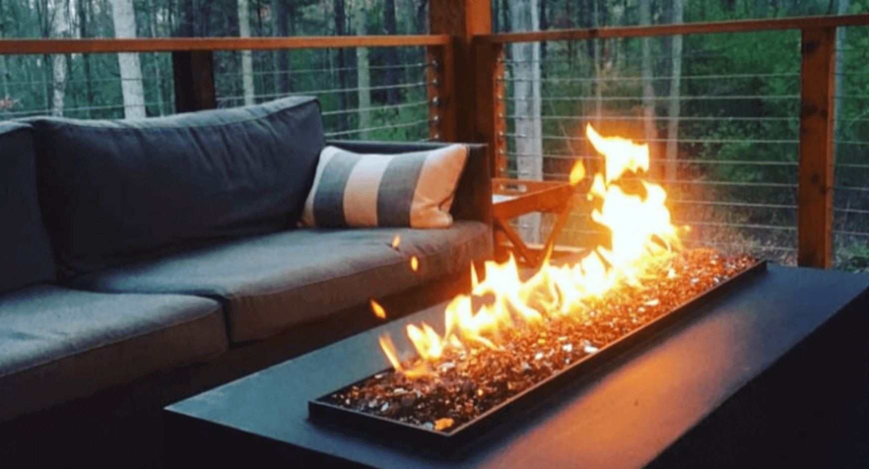 gas fire pit on a pool deck