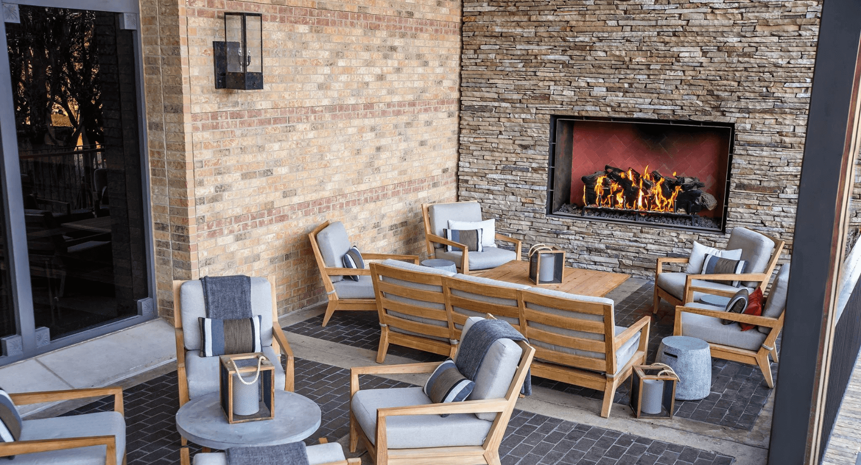 Covered Patio with a Fireplace That Creates a Cozy Gathering Space