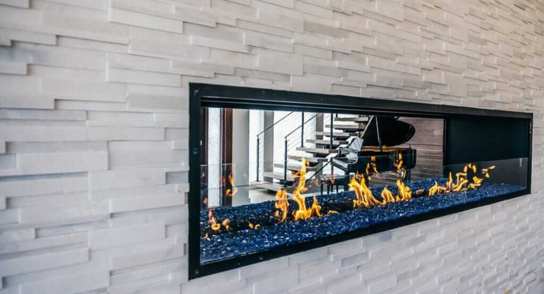 Image of an open gas fireplace with split glass