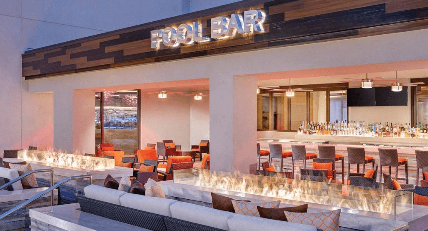 Hotel ideas for an outdoor pool with a fire table